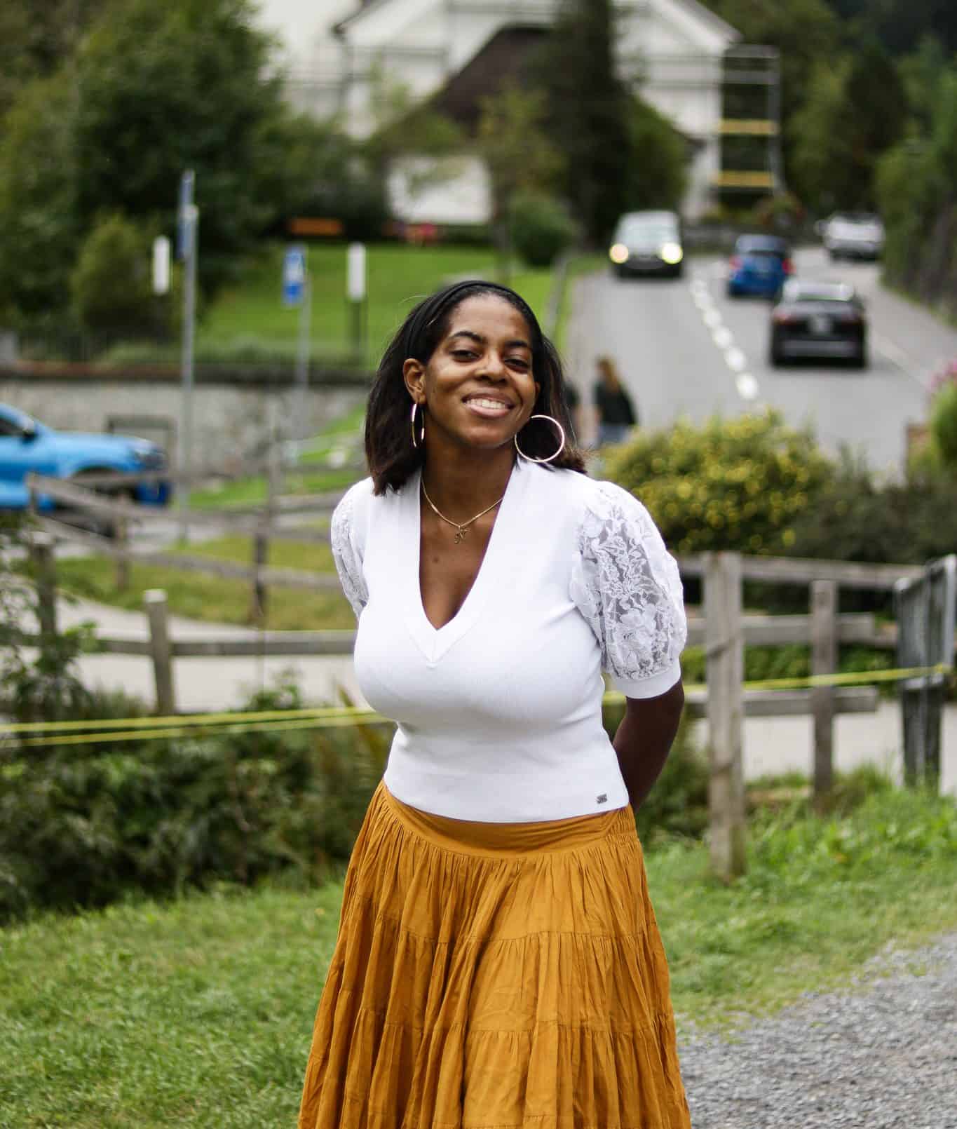 Nma standing in front of the church at Lauterbrunnen