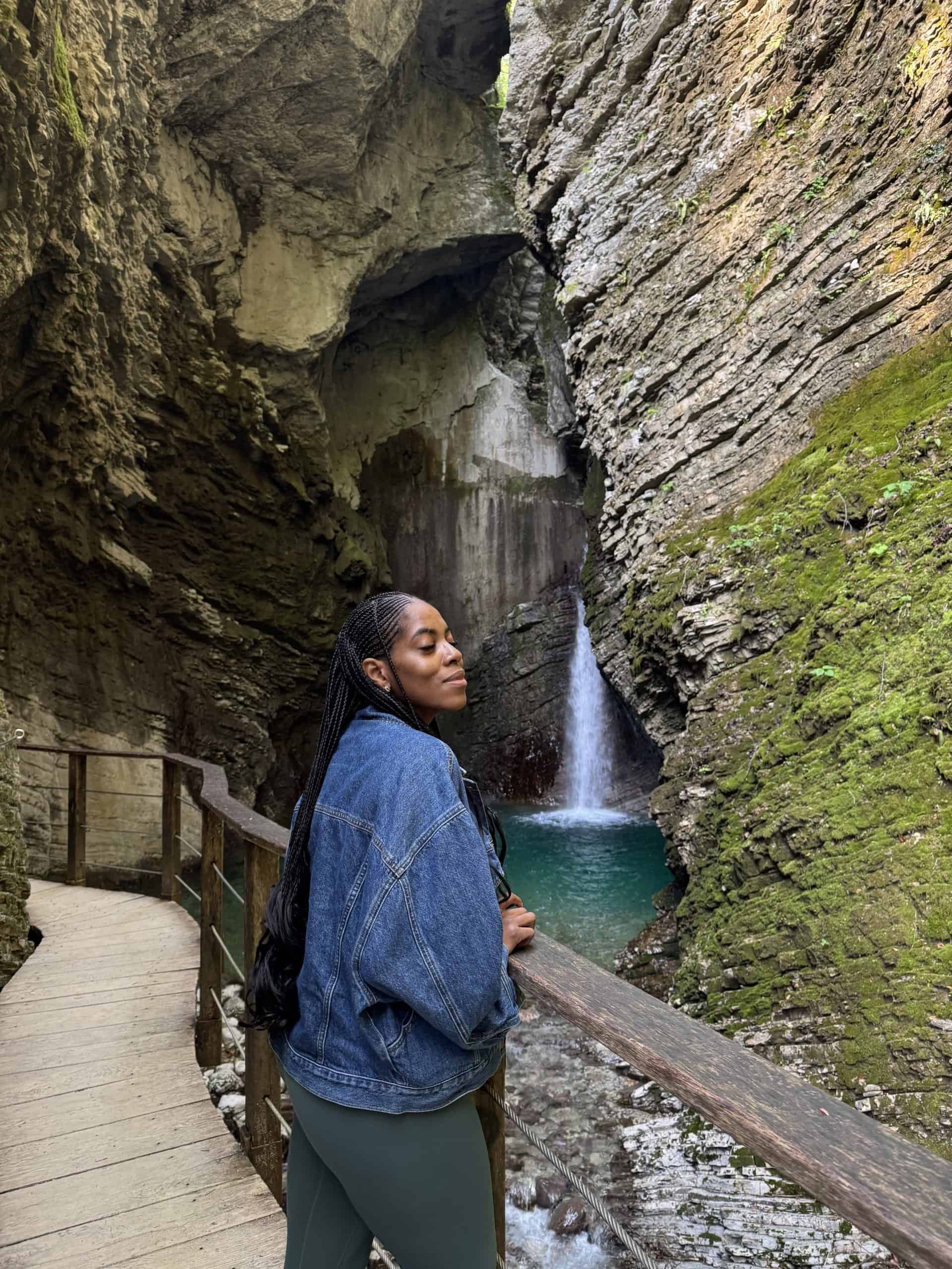 Nma smiling on a bridge at Kozjak Waterfall
