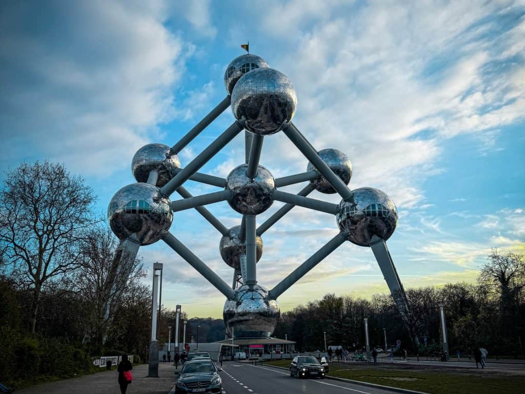 Innovative modern architecture Belgiumn Atomium sculpture with reflective spheres and futuristic design at sunset.