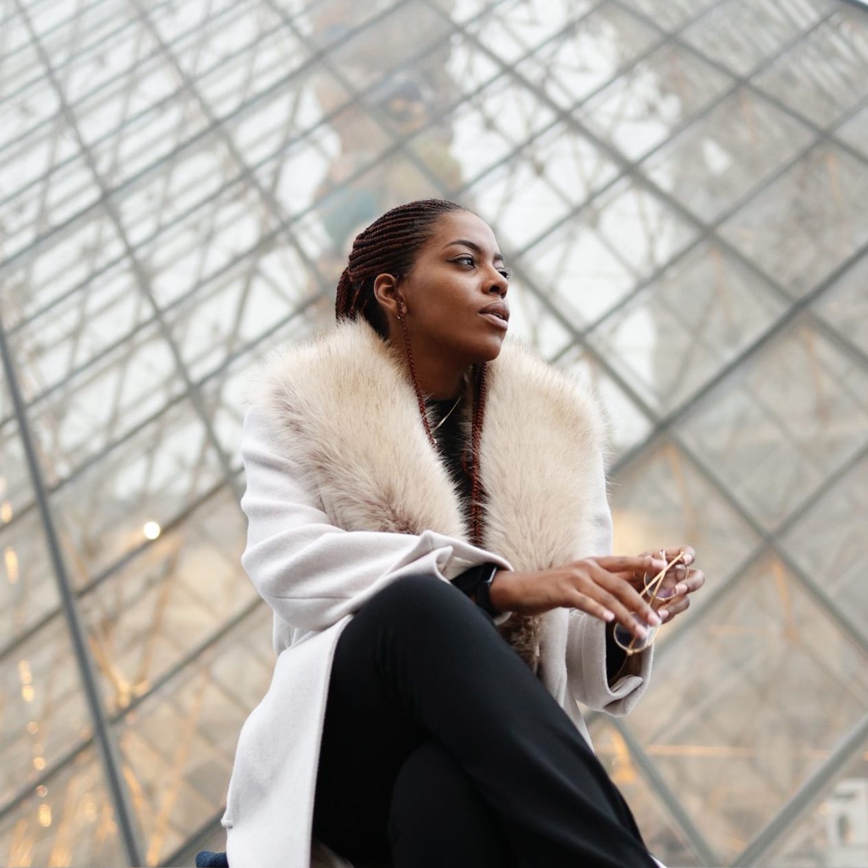 Nma sitting in front of the Louvre, Paris France.